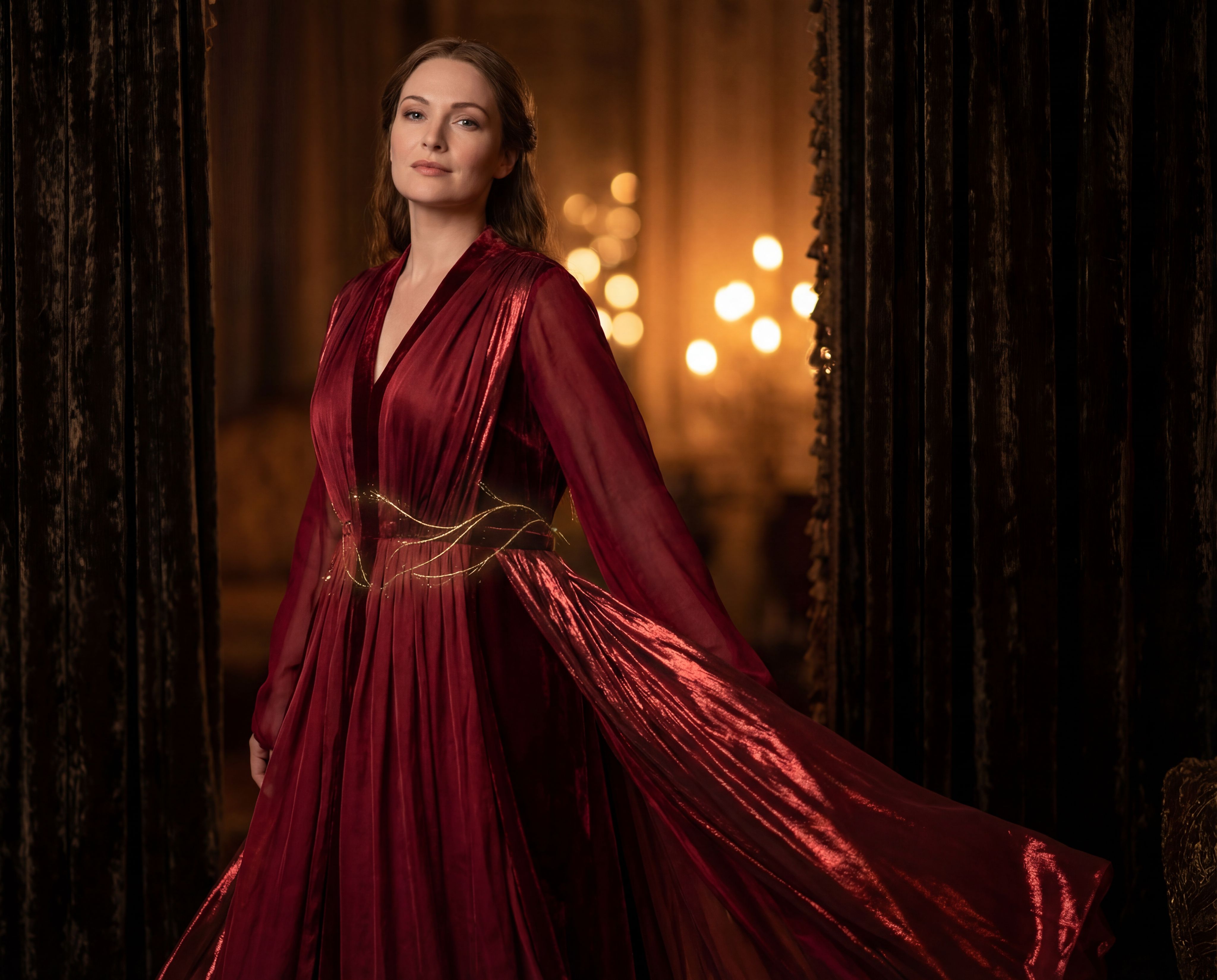 Wearing an exquisite deep-crimson gown inspired by haute cou
